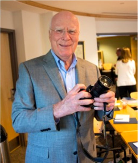 Senator Patrick Leahy holding a camera